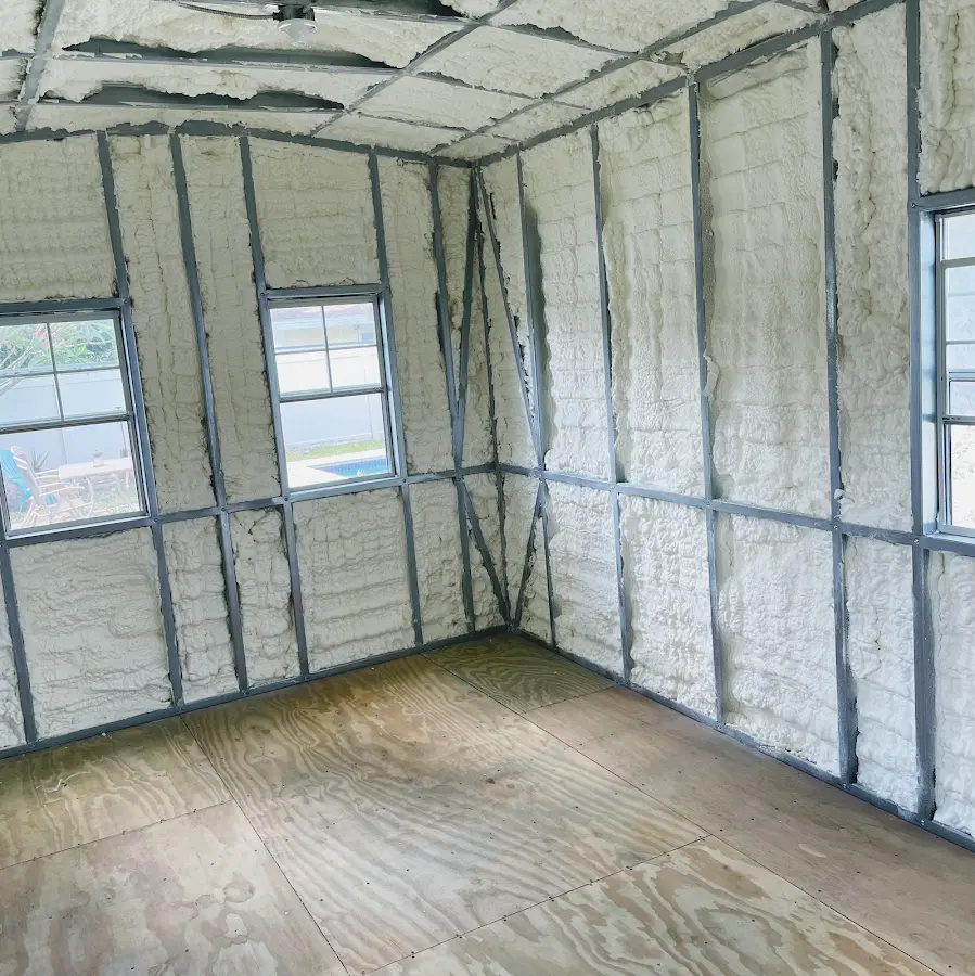 Closed-cell spray foam insulation applied to wall cavities in a residential project in Gonzalez
